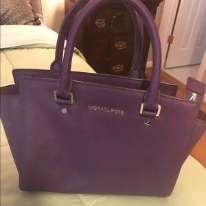 Purple Michael Kors bag (black strap is frayed)